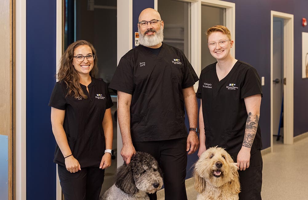 group of technicians smiling for the camera